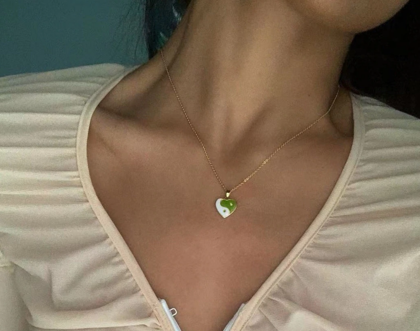 Close-up of heart-shaped Yin Yang pendant