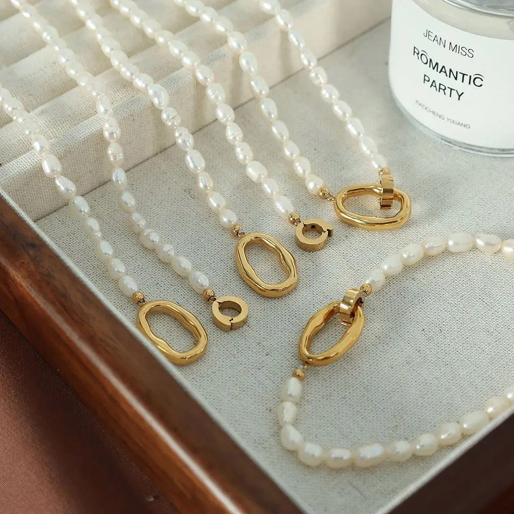 Flatlay of gold-plated natural pearl necklace
