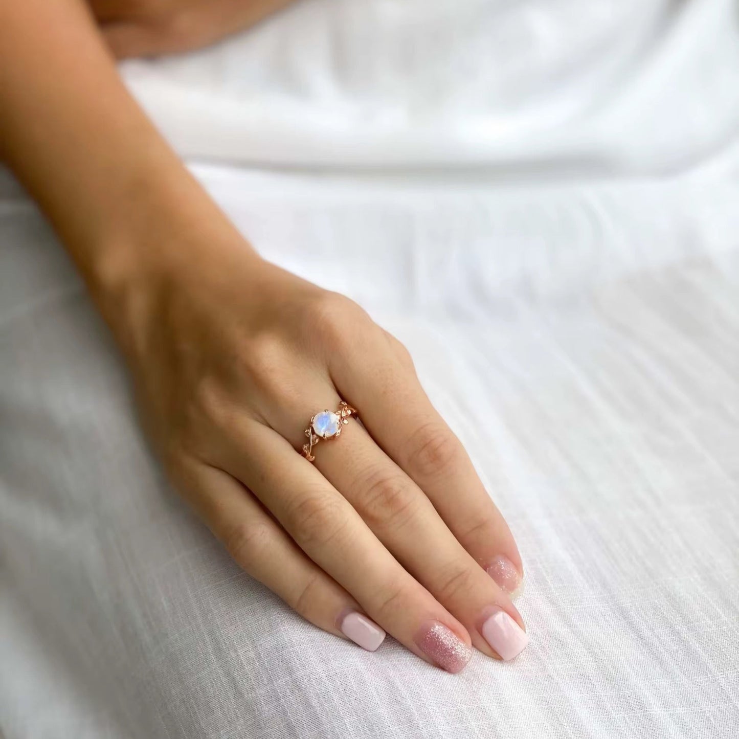 Open band design of adjustable moonstone ring