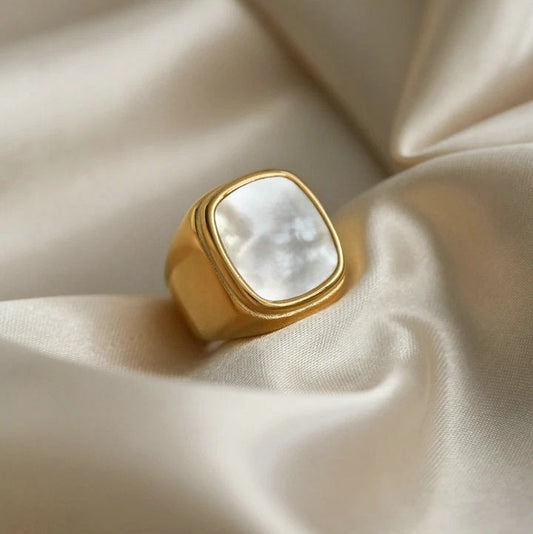 Front view of chunky shell ring with opal gemstone