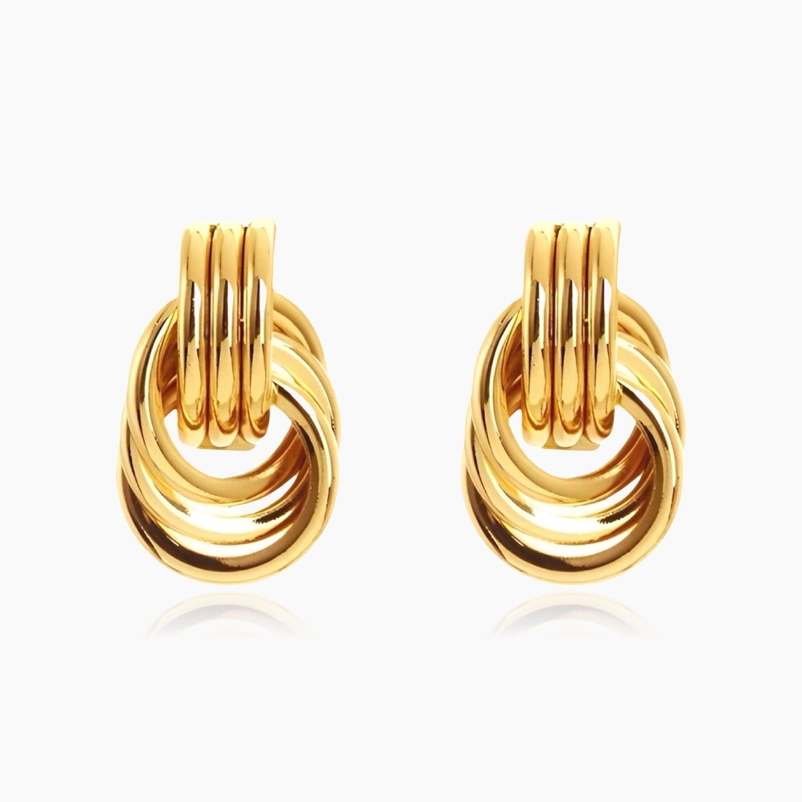 Front view of Clean Knot gold and silver geometric earrings