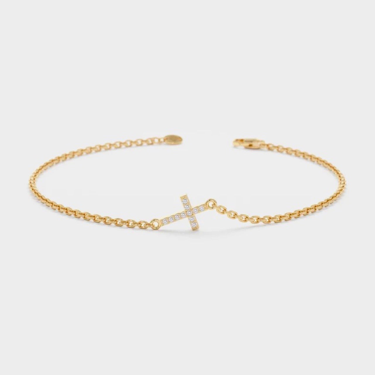 Elegant dainty cross bracelet with crystals – front view