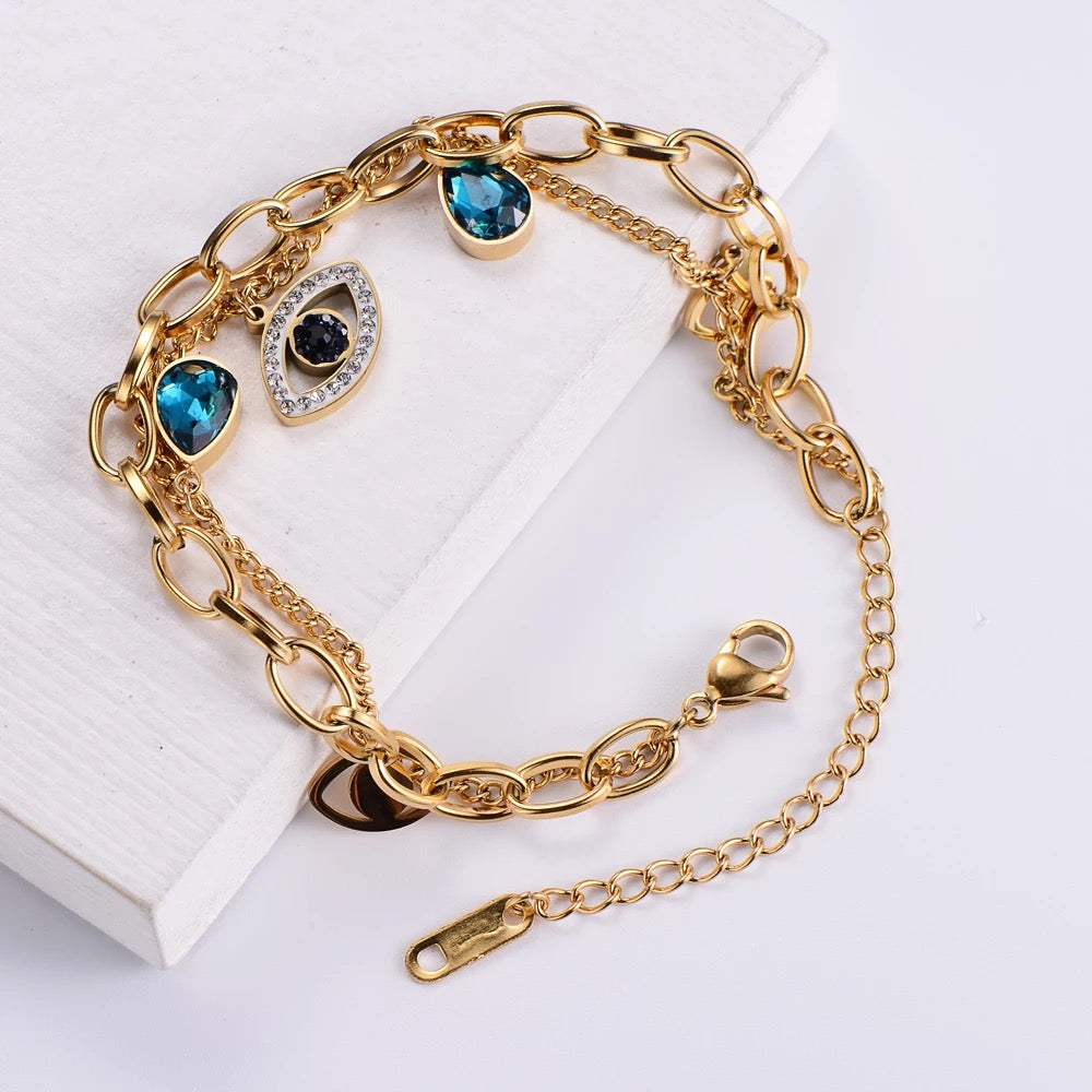 Evil Eye bracelet shown on both male and female wrists