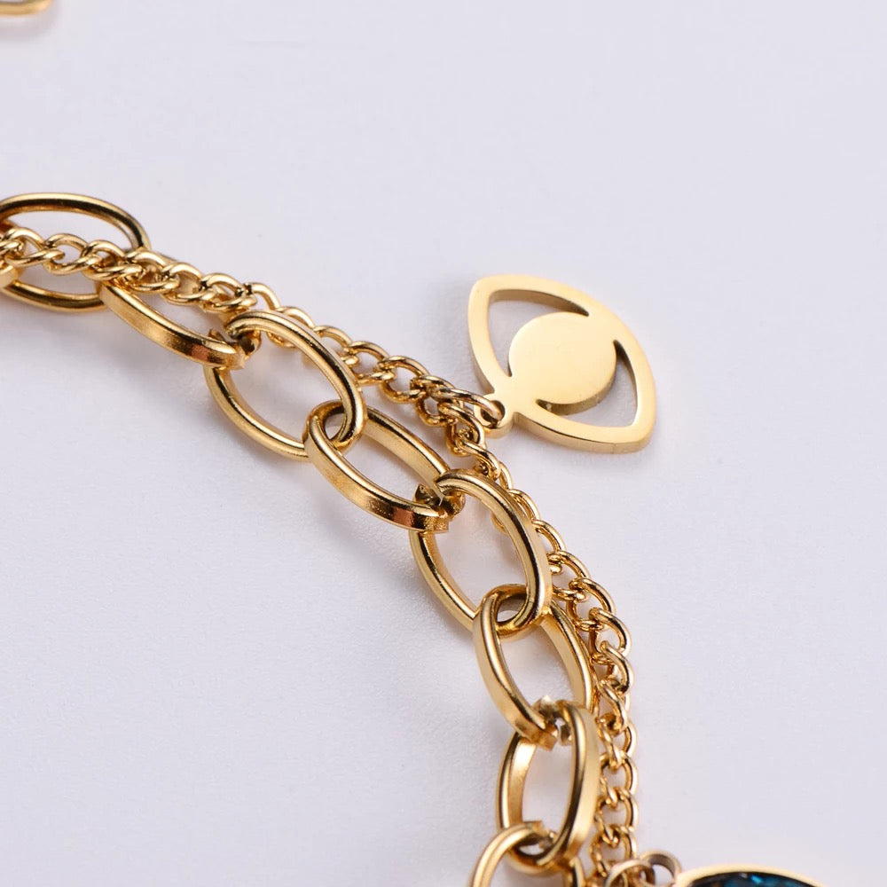 Detail of gold Evil Eye bracelet with double chain