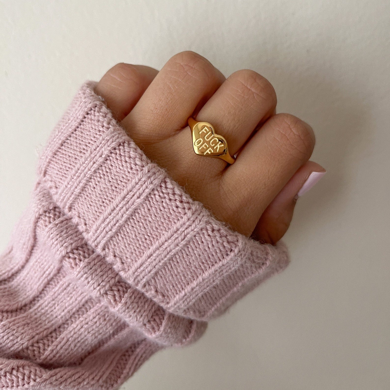 Fck Off ring styled on hand with bold look