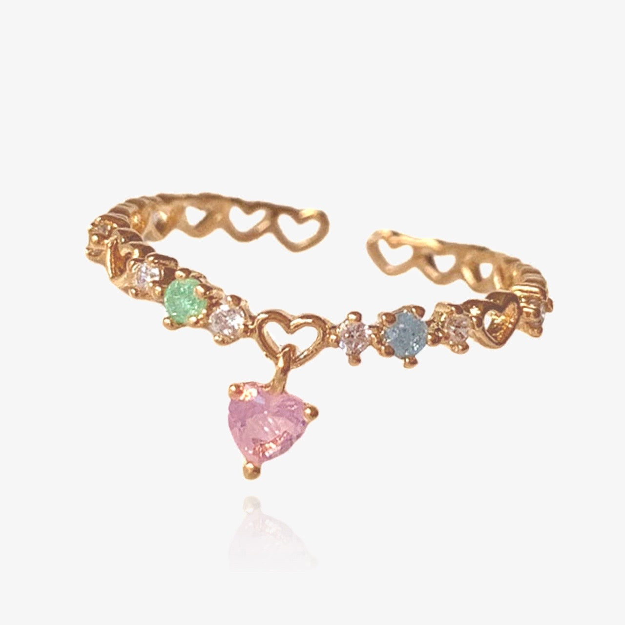 Heart charm ring styled with other stacking rings