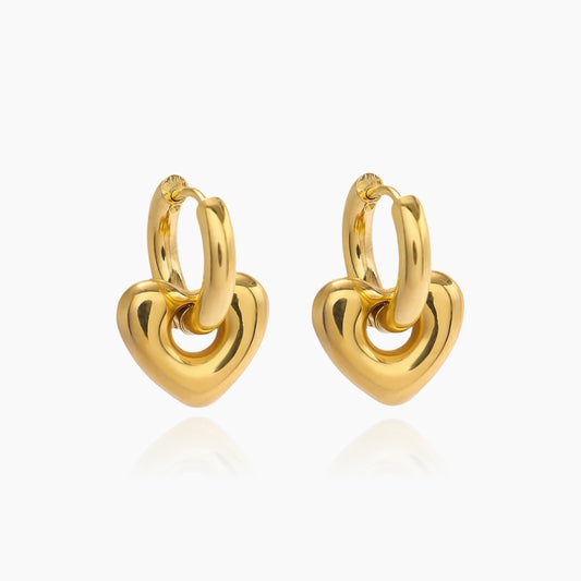 Front view of heart huggie transformer earrings in gold