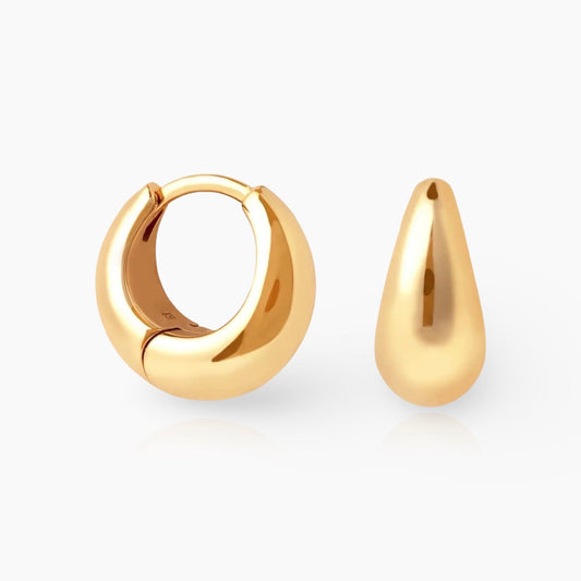 Front view of KAYA mini huggie hoop earrings in gold and silver