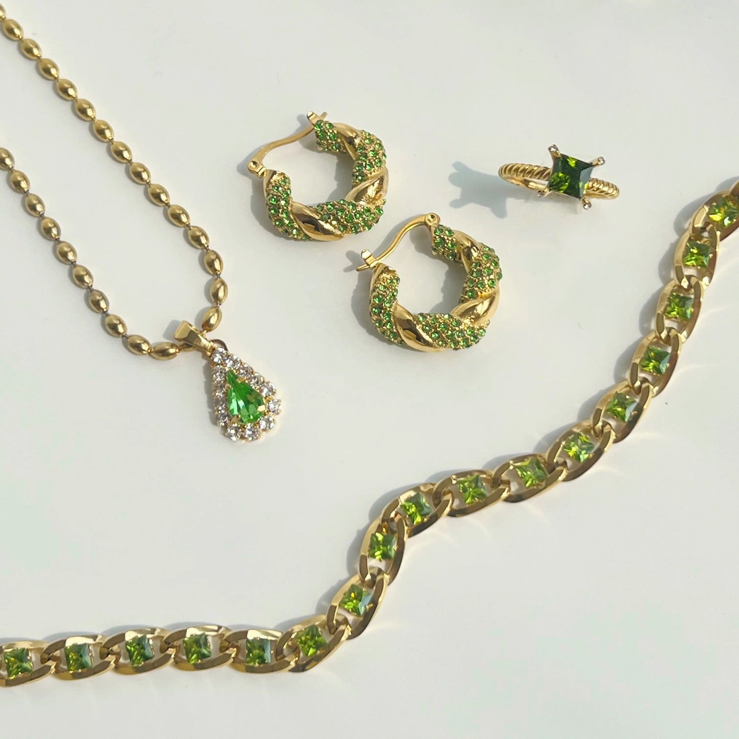 Detailed texture of MADDIE green CZ pave setting