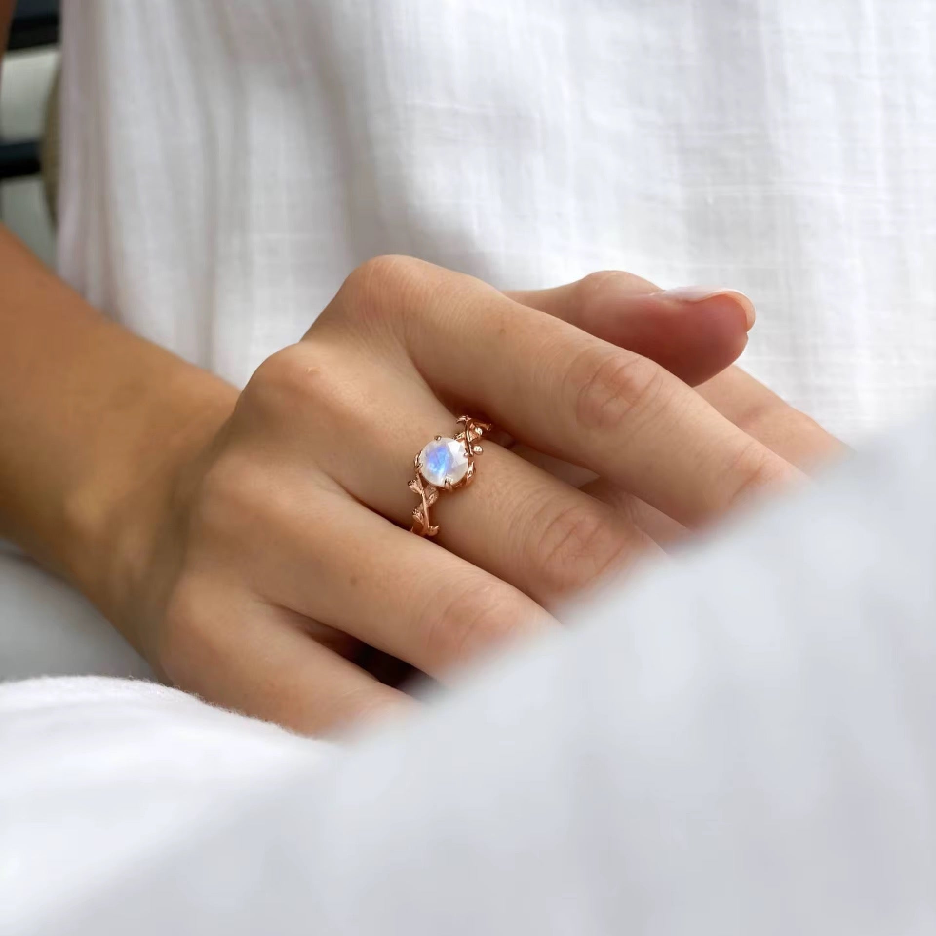 Moonstone engagement ring with soft lighting and sparkle