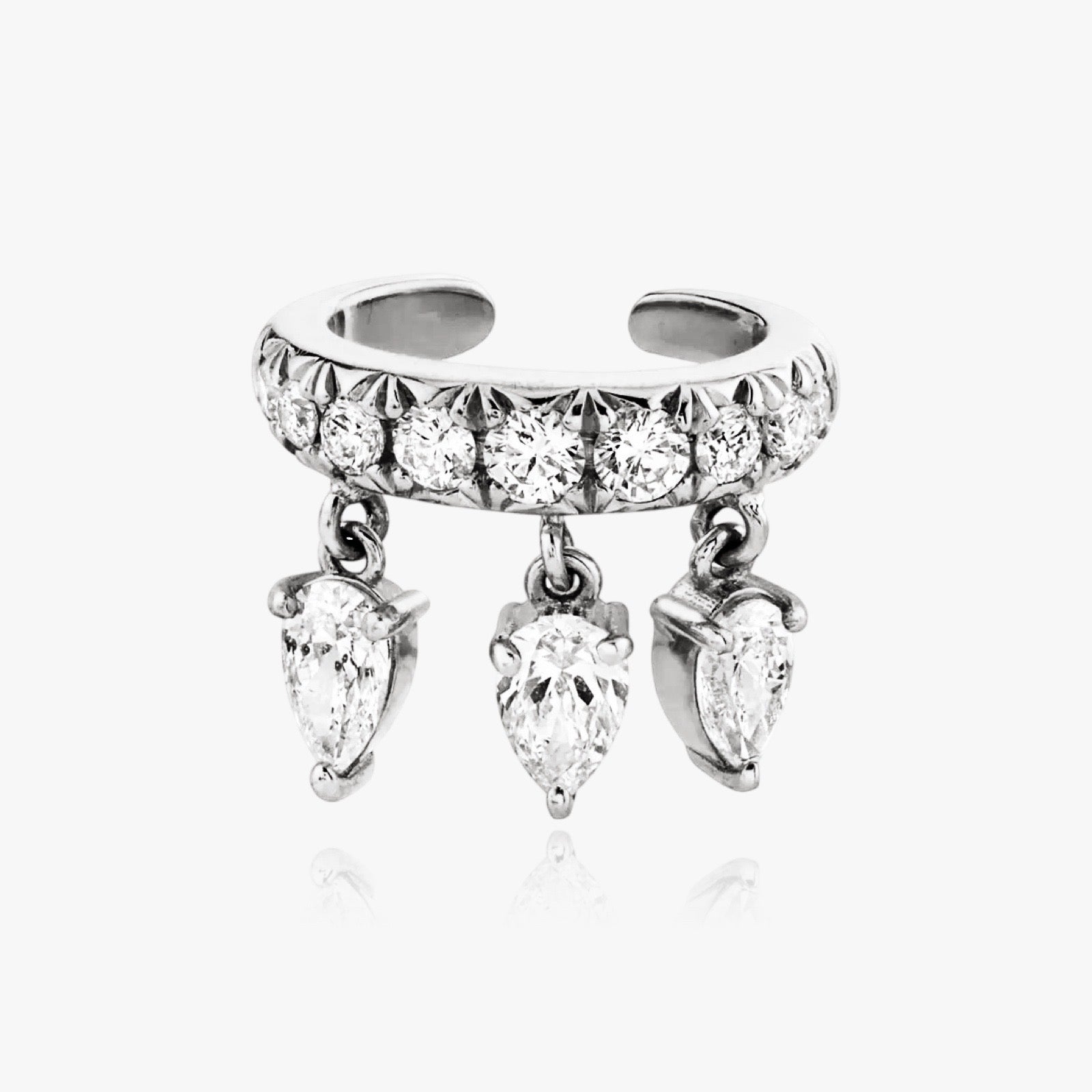 Close-up of pear cut zirconia on silver cuff earring