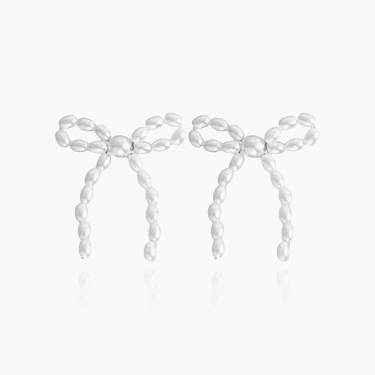 Pearl bow tie earrings in elegant front view