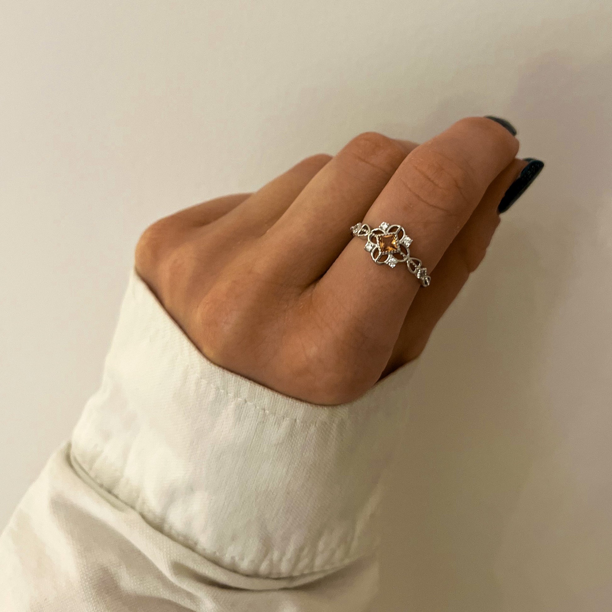 Royal Ring styled on hand showing adjustable design