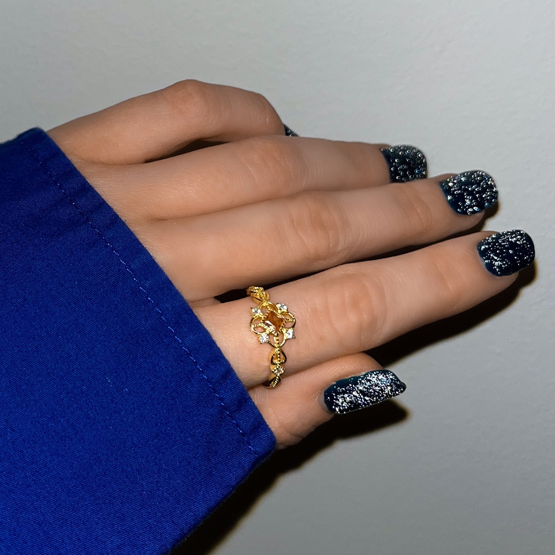 Royal Ring stacked with other rings for a layered look