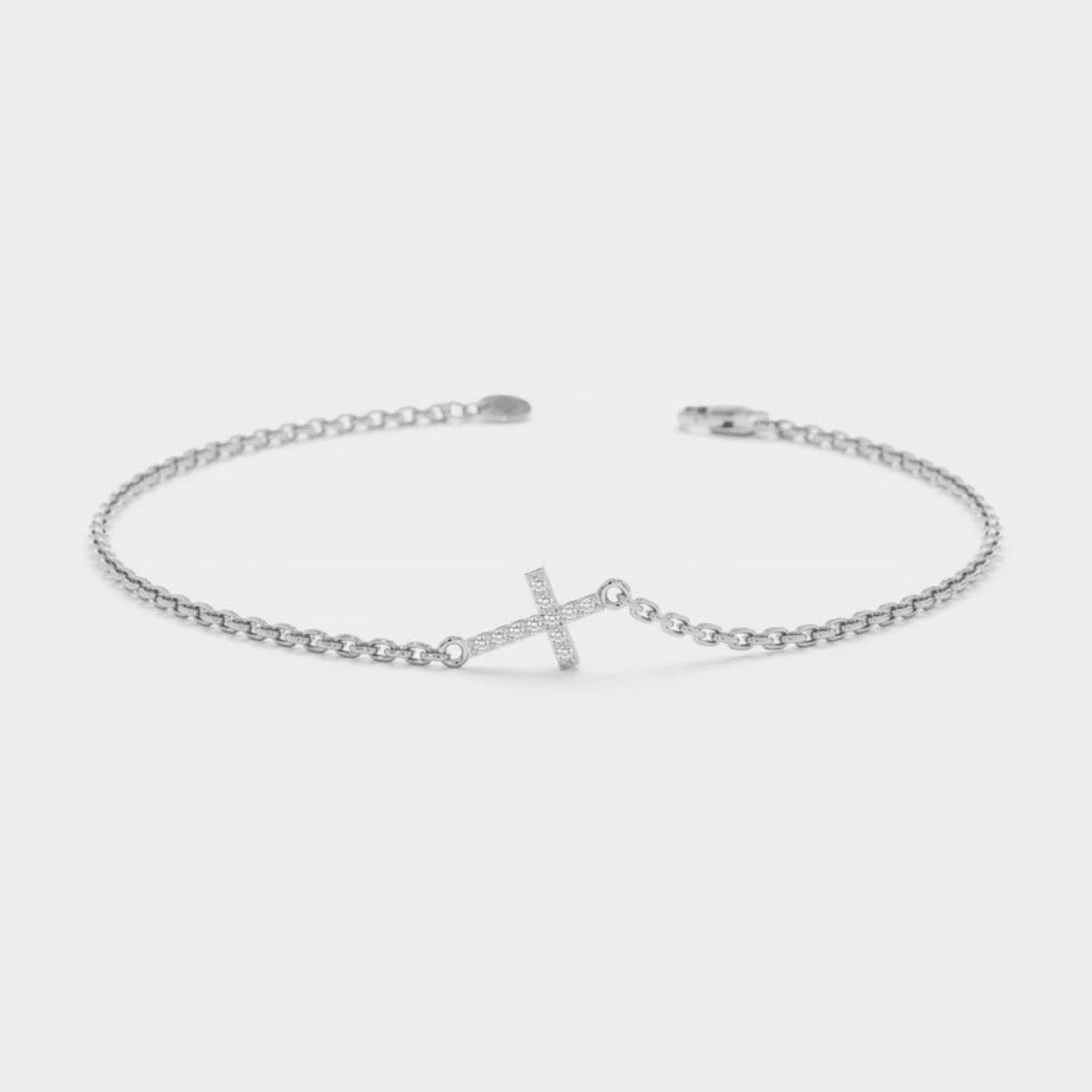 Dainty cross bracelet in gold and silver finishes