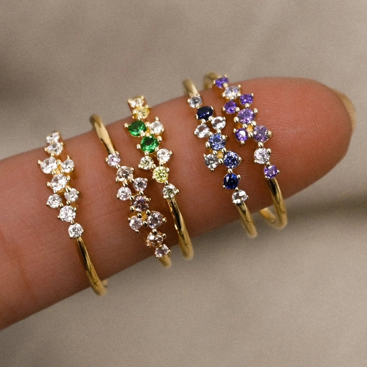 Stardust ring shown next to sizing guide (5–10)