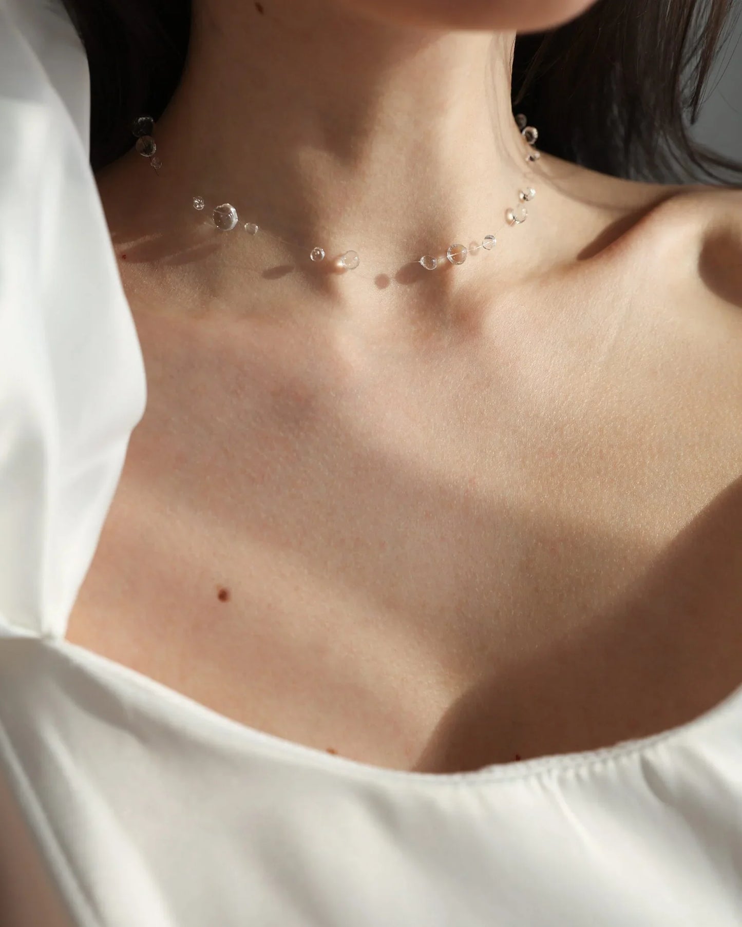 Rain-inspired waterproof necklace with silver closure
