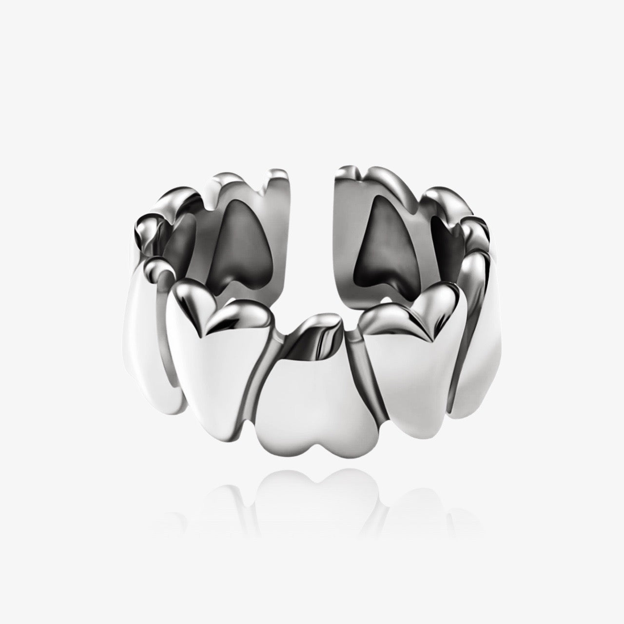 Stackable hearts wrap ring styled with other rings